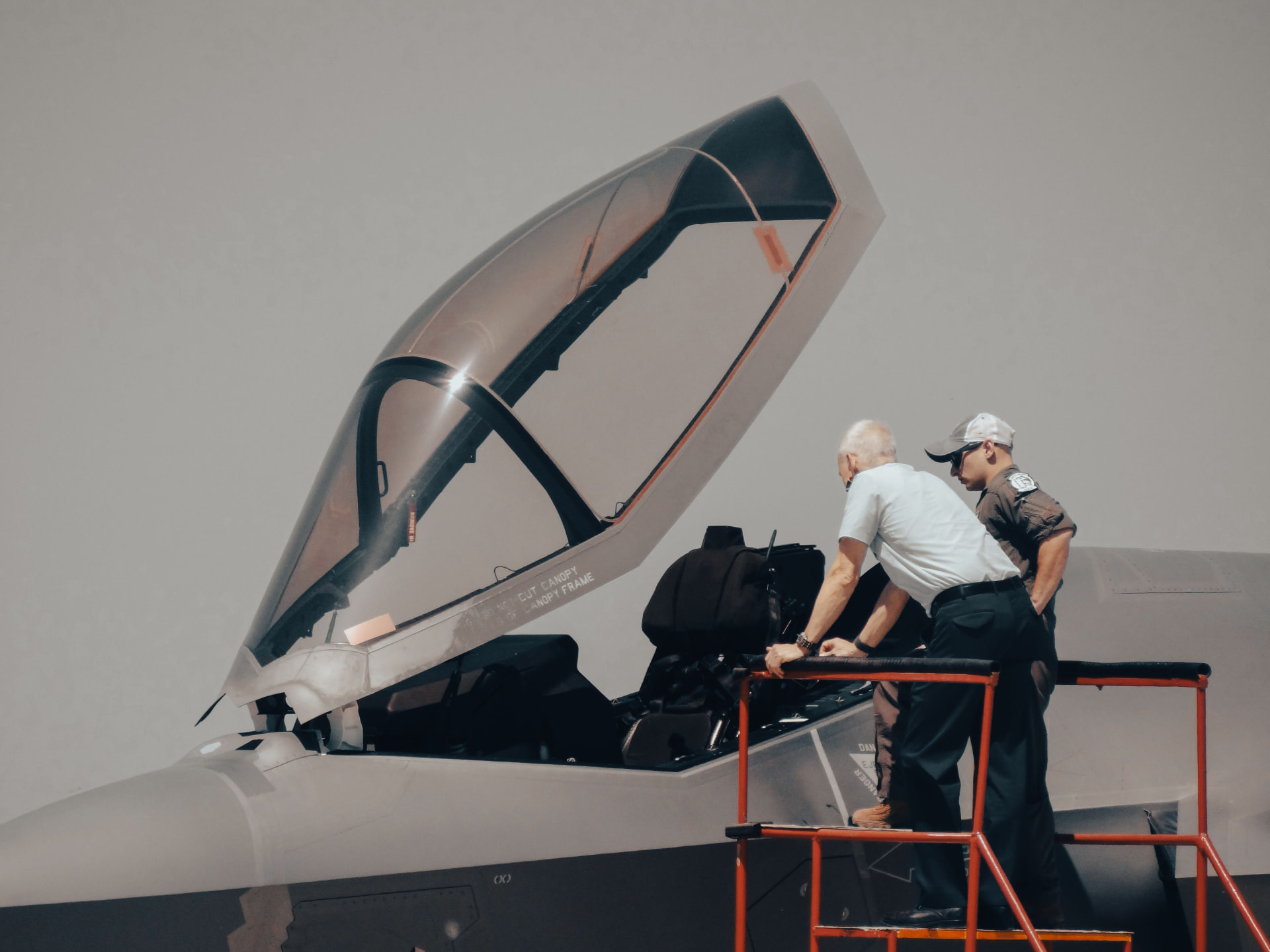 Technician working beside an exposed helicopter rotor head