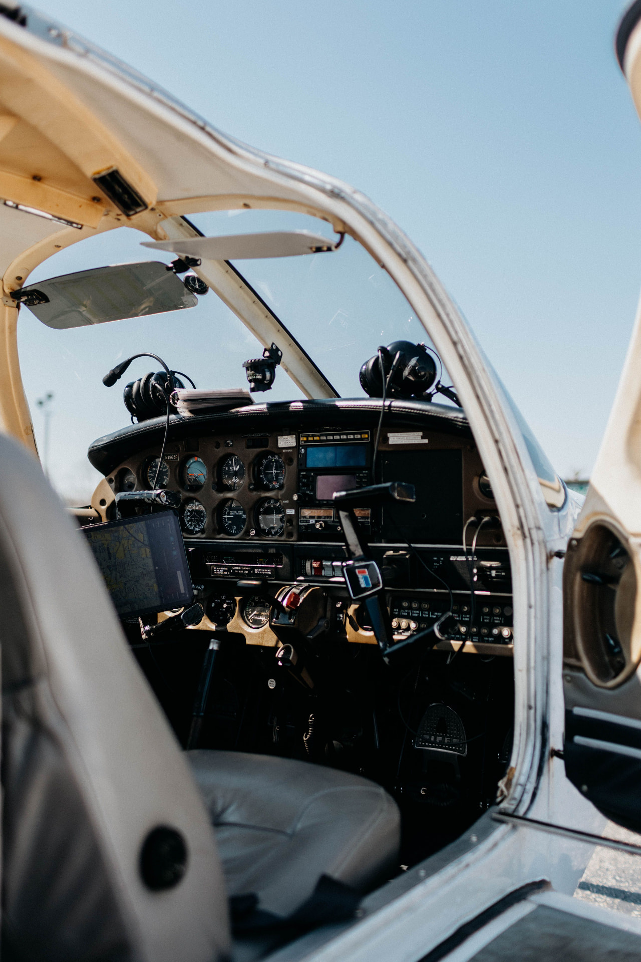 Light aircraft parked on a grass airfield