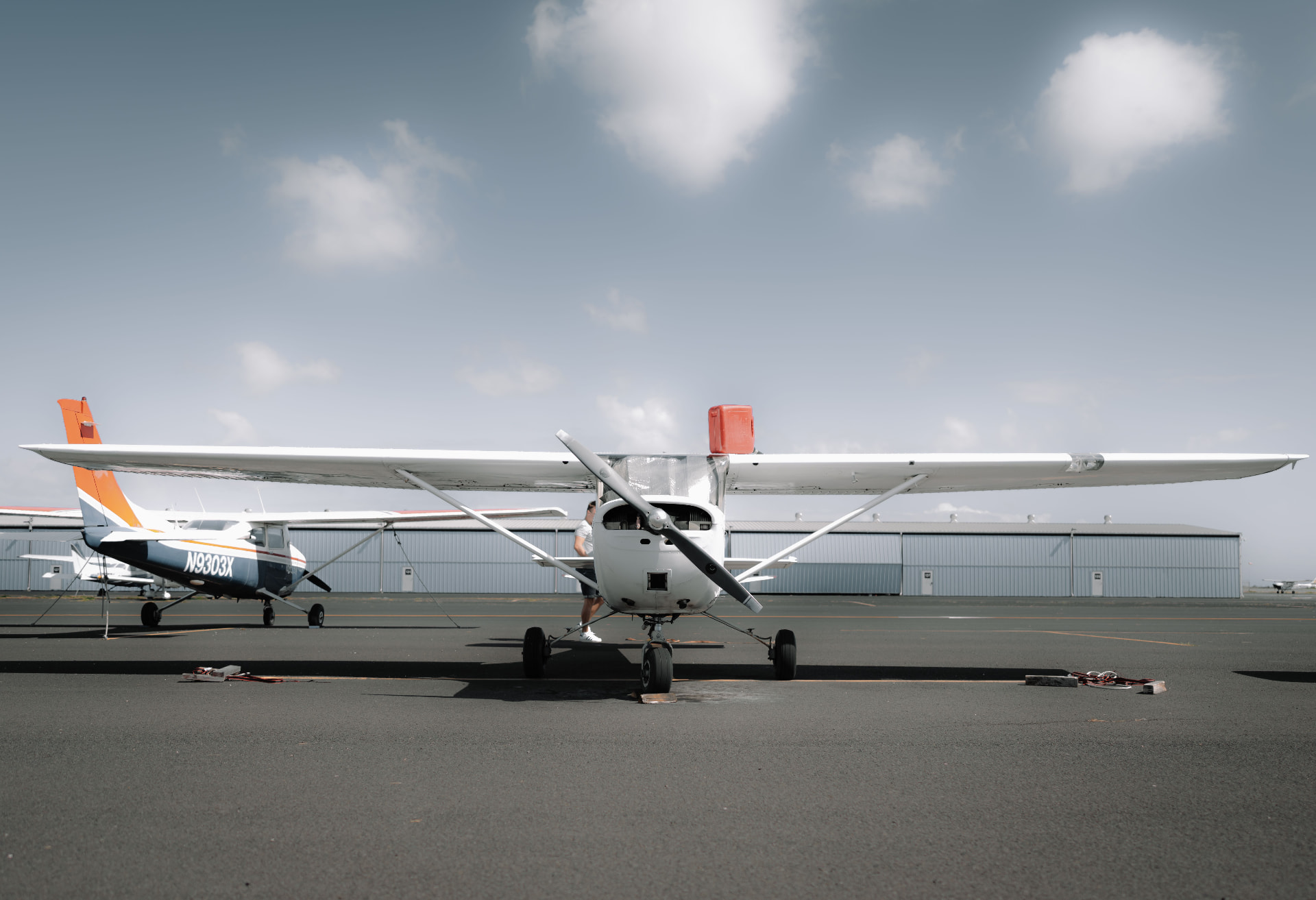 Light aircraft parked on an airport ramp