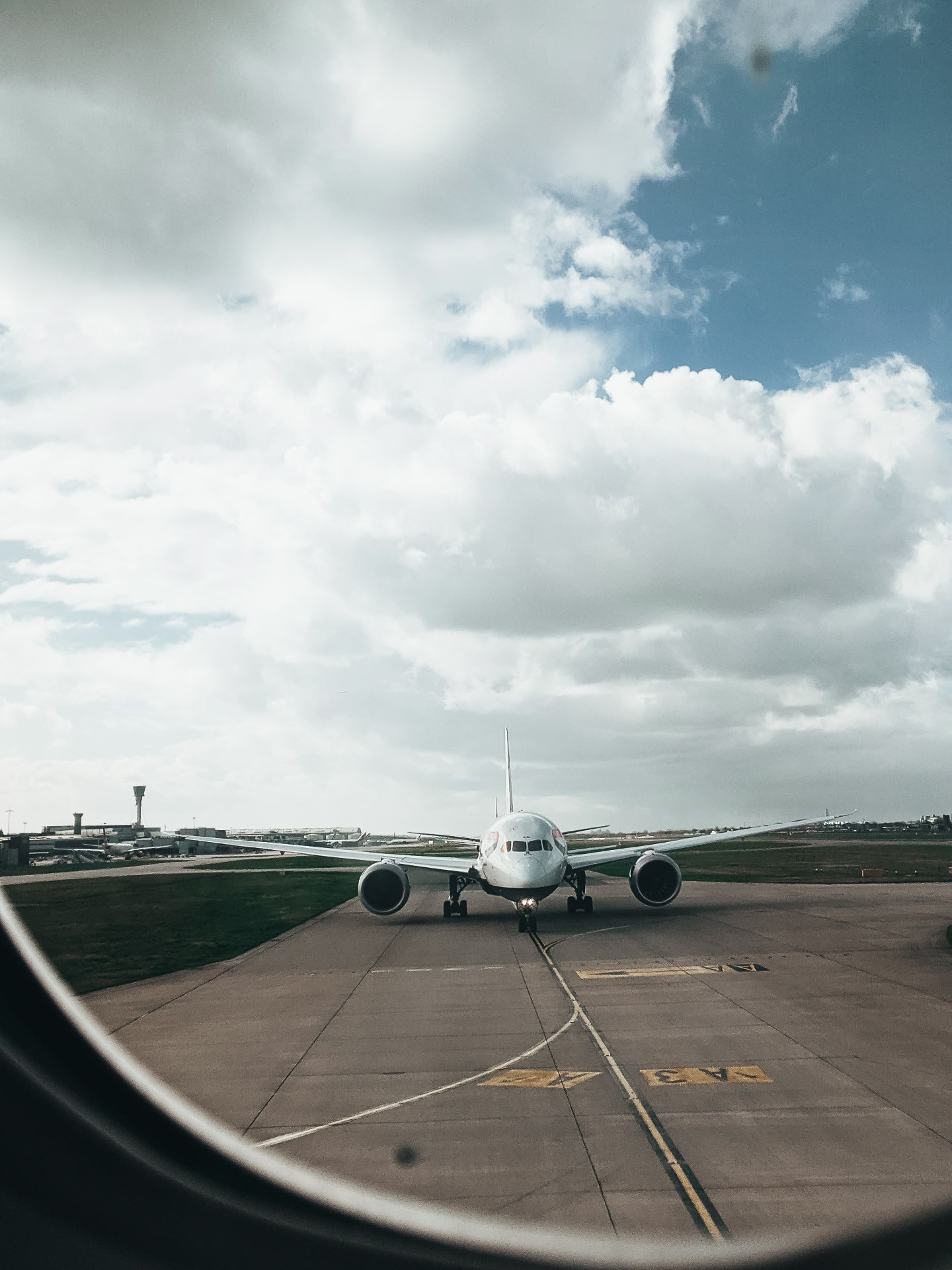 Airliner facing forward on an airport taxiway