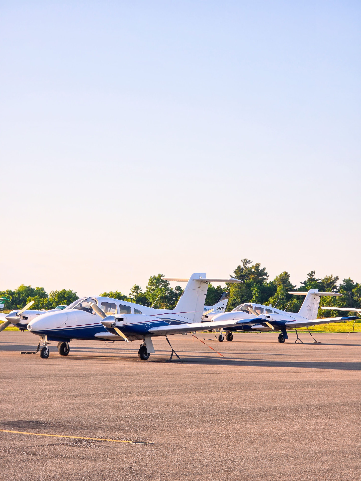 Light aircraft parked on an airport ramp
