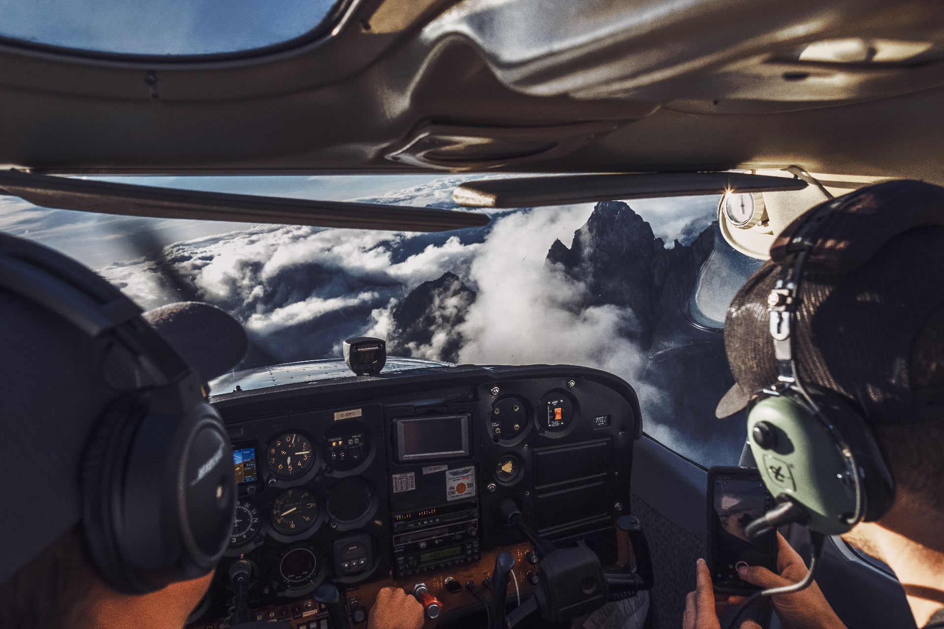 Instructor and student flying above mountains