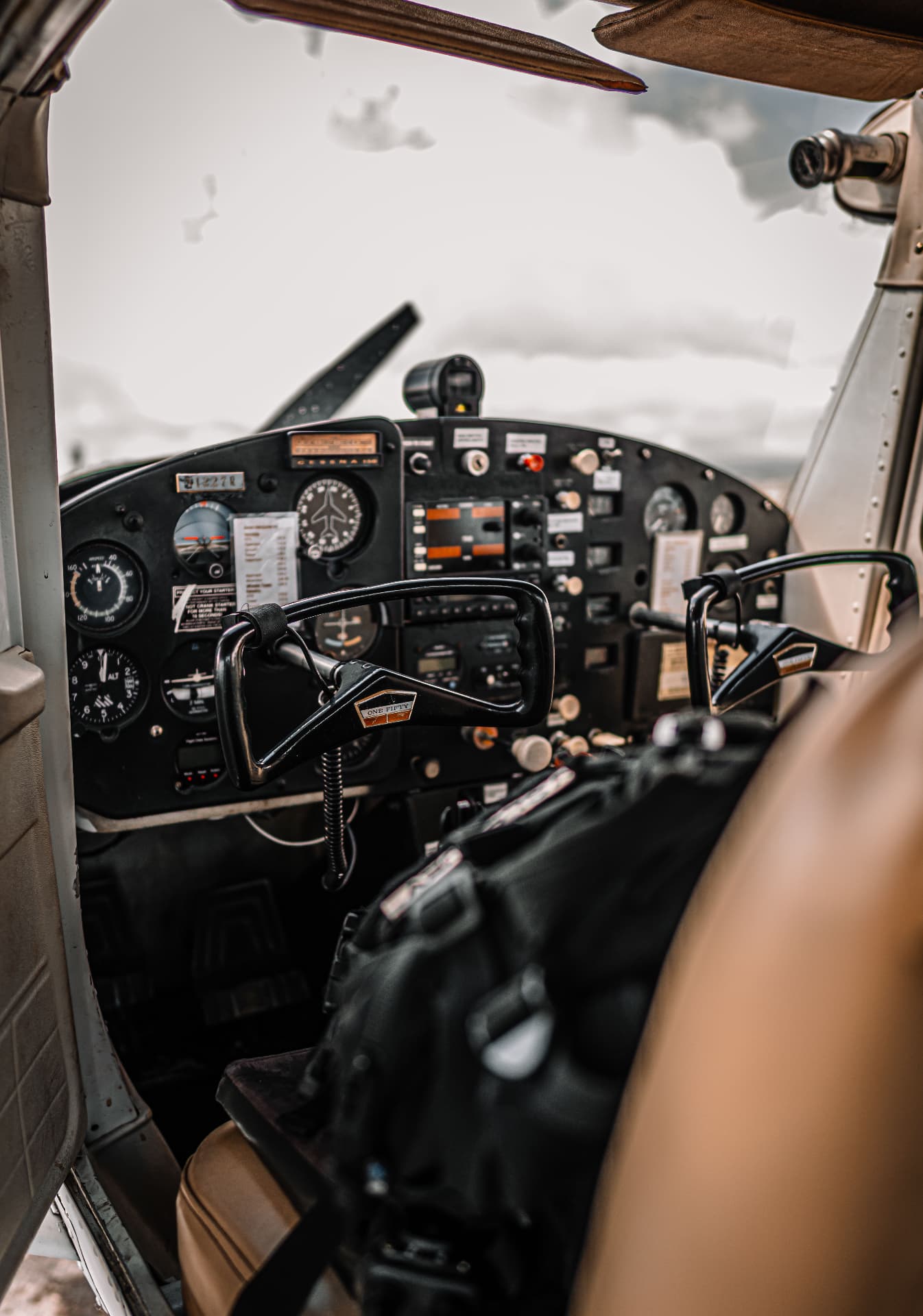 View of a light aircraft instrument panel from the pilot seat