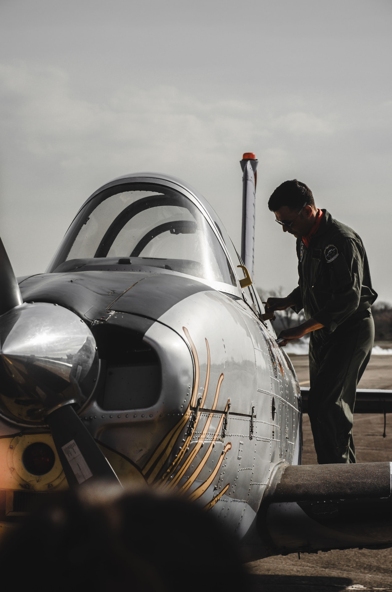 Pilot inspecting a light aircraft